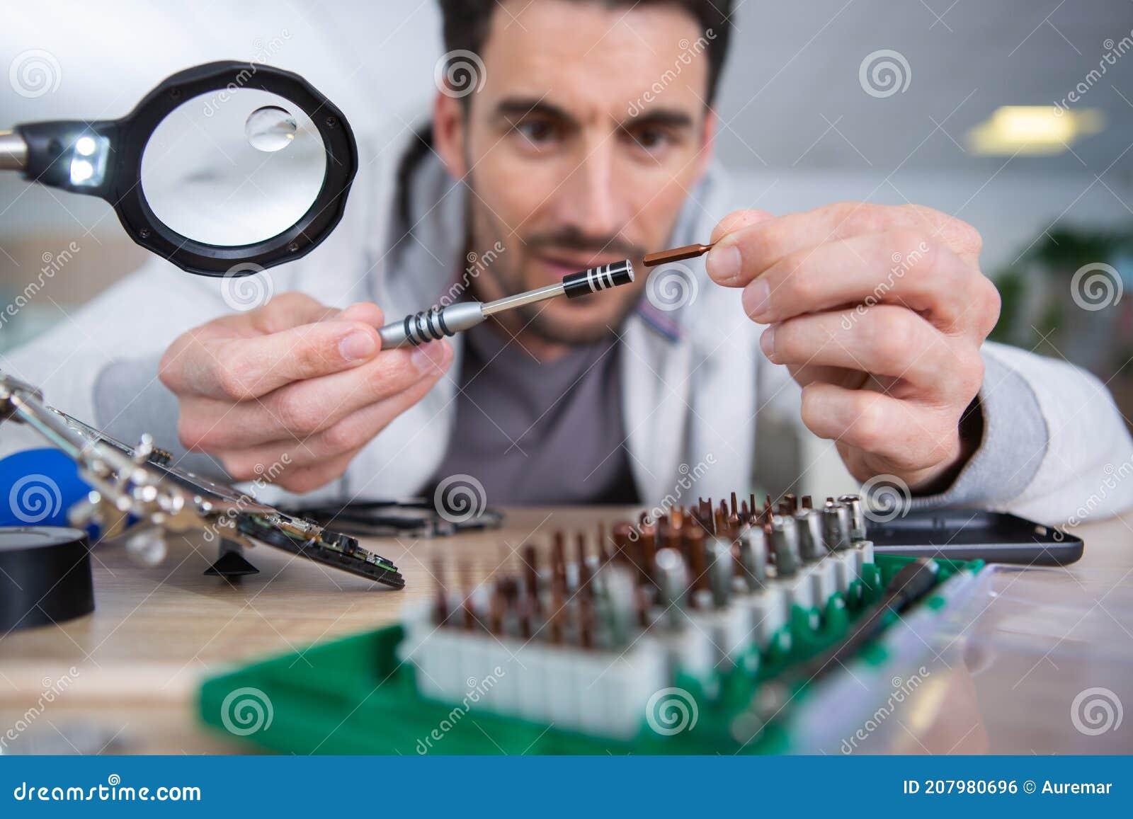 Engineer Soldering Microcircuit Though Magnifier Stock Photo Image of