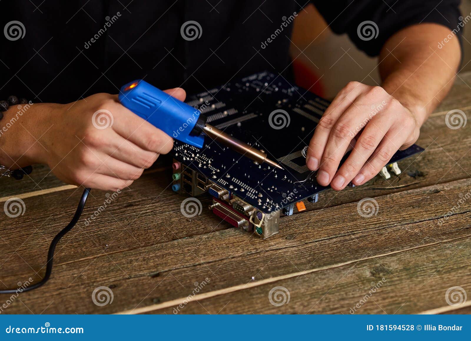 Engineer or Technician Repair Electronic Circuit Board with Soldering