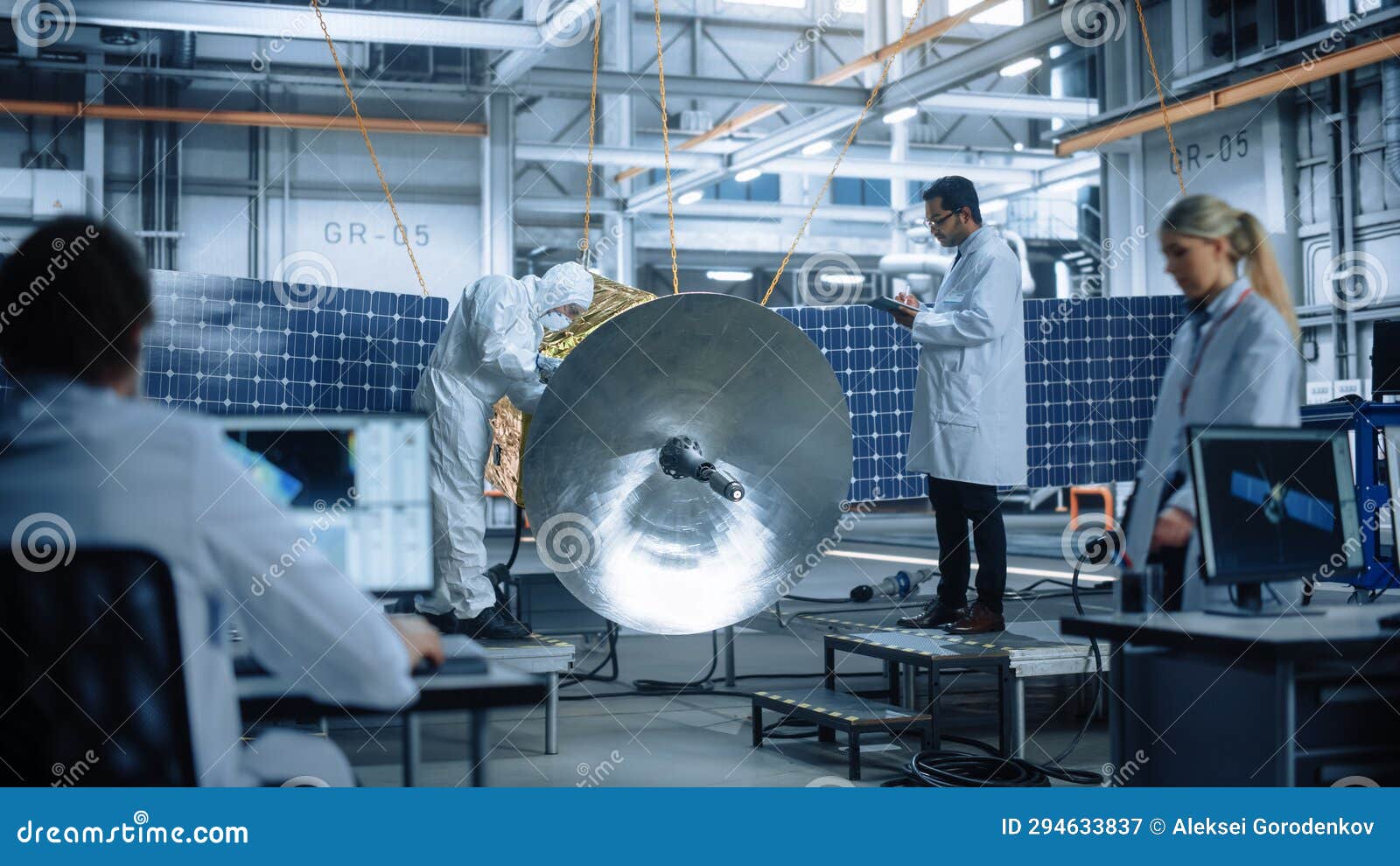 Engineer and Technician Working on Satellite Construction. Aerospace Agency Diverse Team of