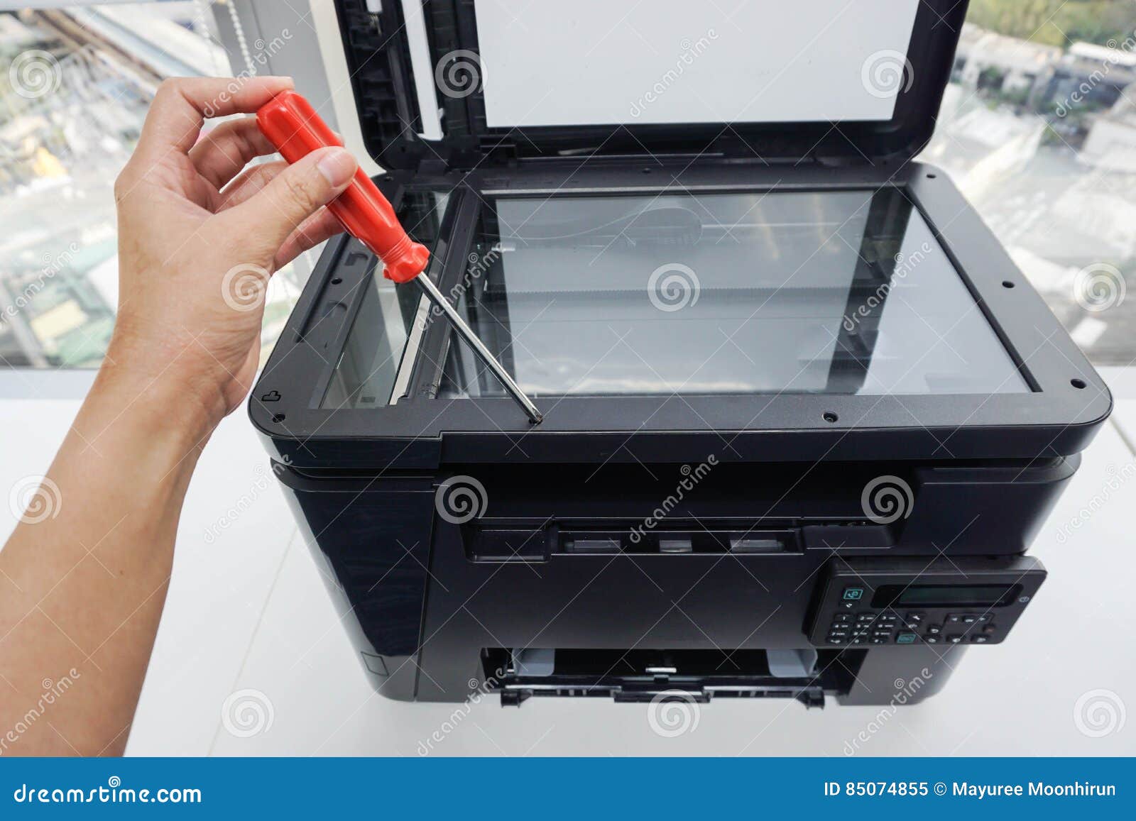 Engineer Use Red Screwdriver for Printer Maintenance Service Stock