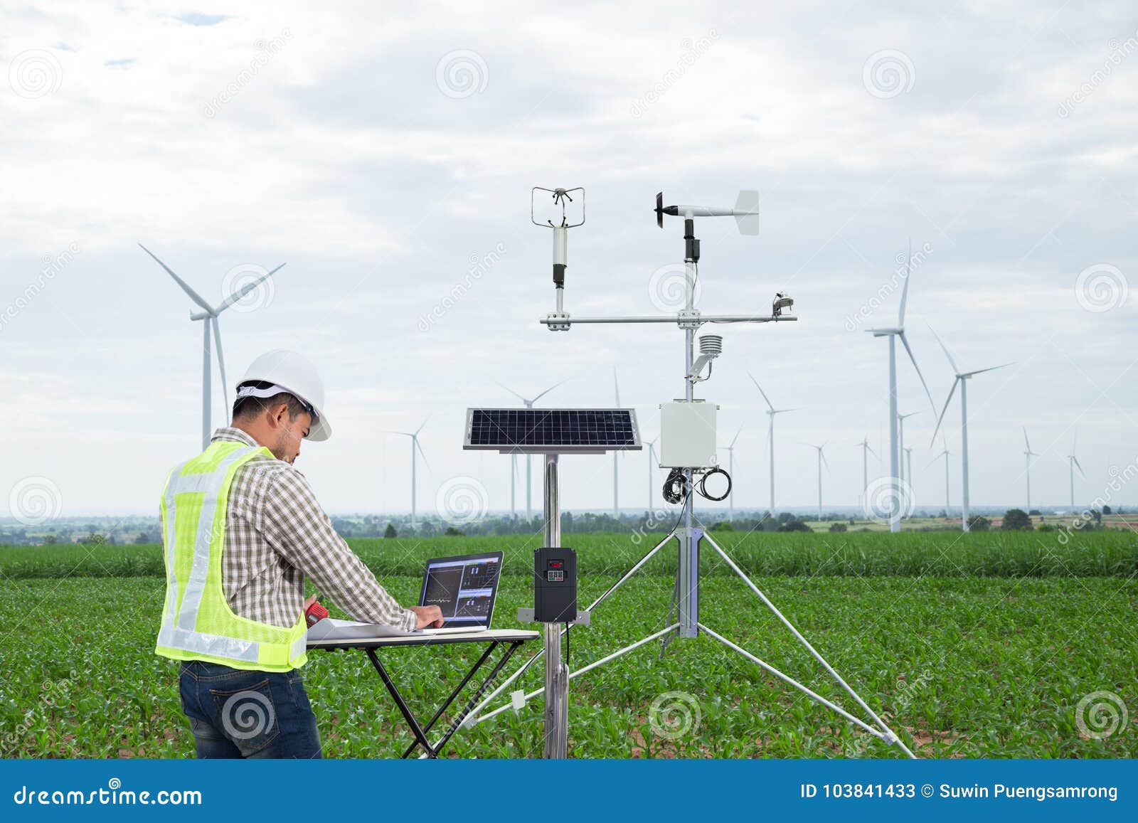engineer using tablet computer collect data with meteorological