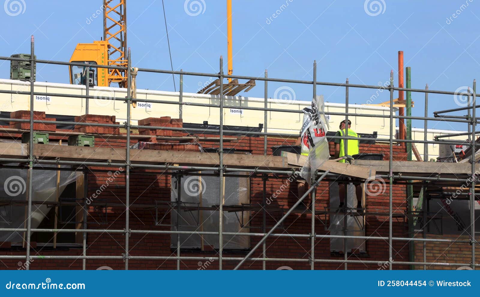 Coworkers on Scaffolding Time Lapse Construction Site Handling Bricks