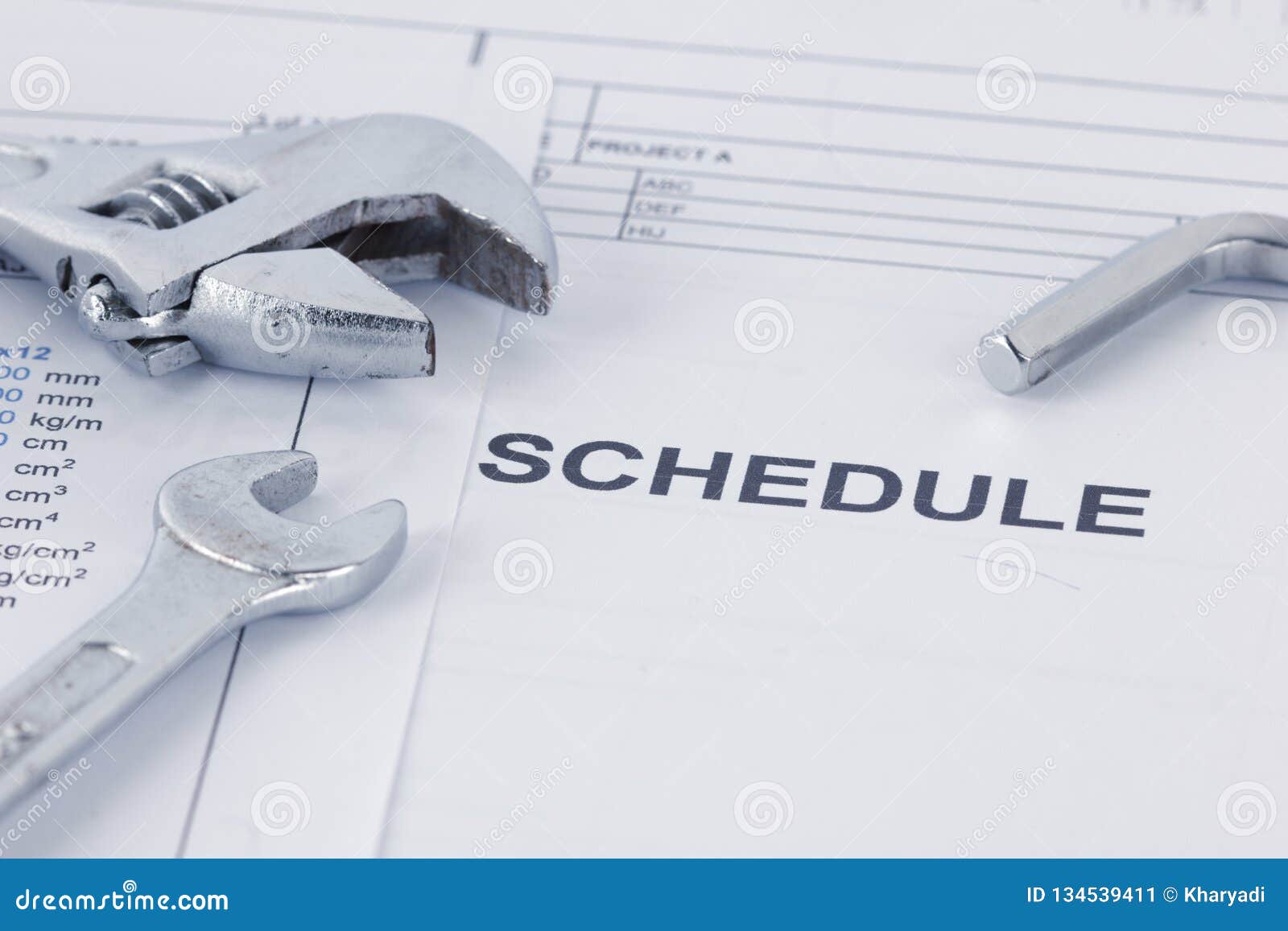 engineering schedule documents with wrench. maintencance concept
