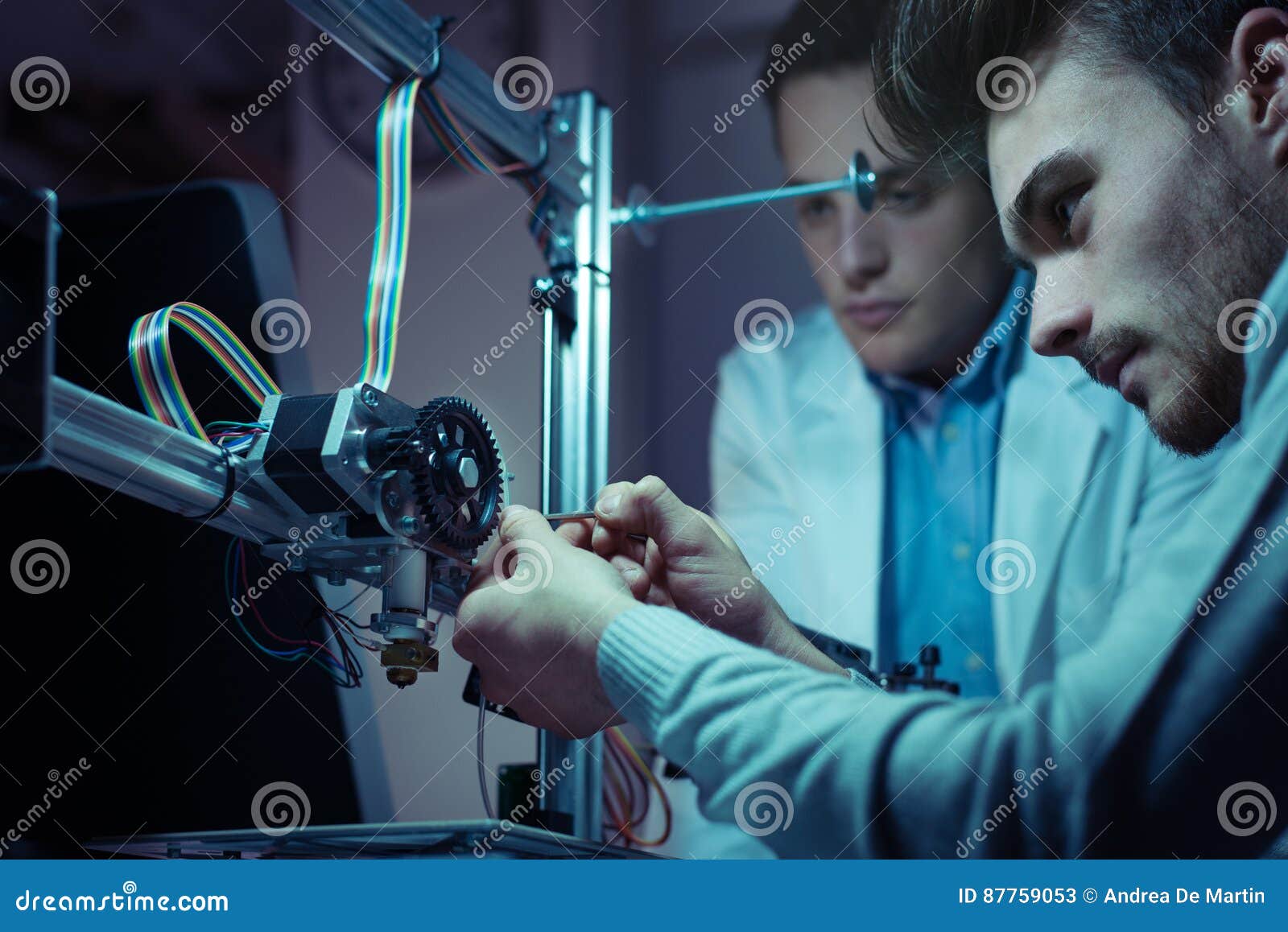 engineering team working on a 3d printer