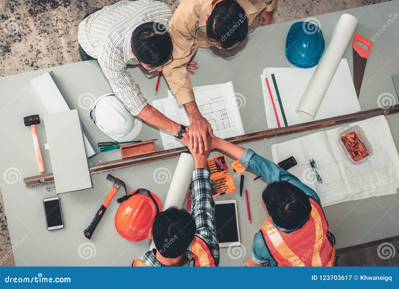 Engineers and Architecture Joining Handshake Together after Meet Stock