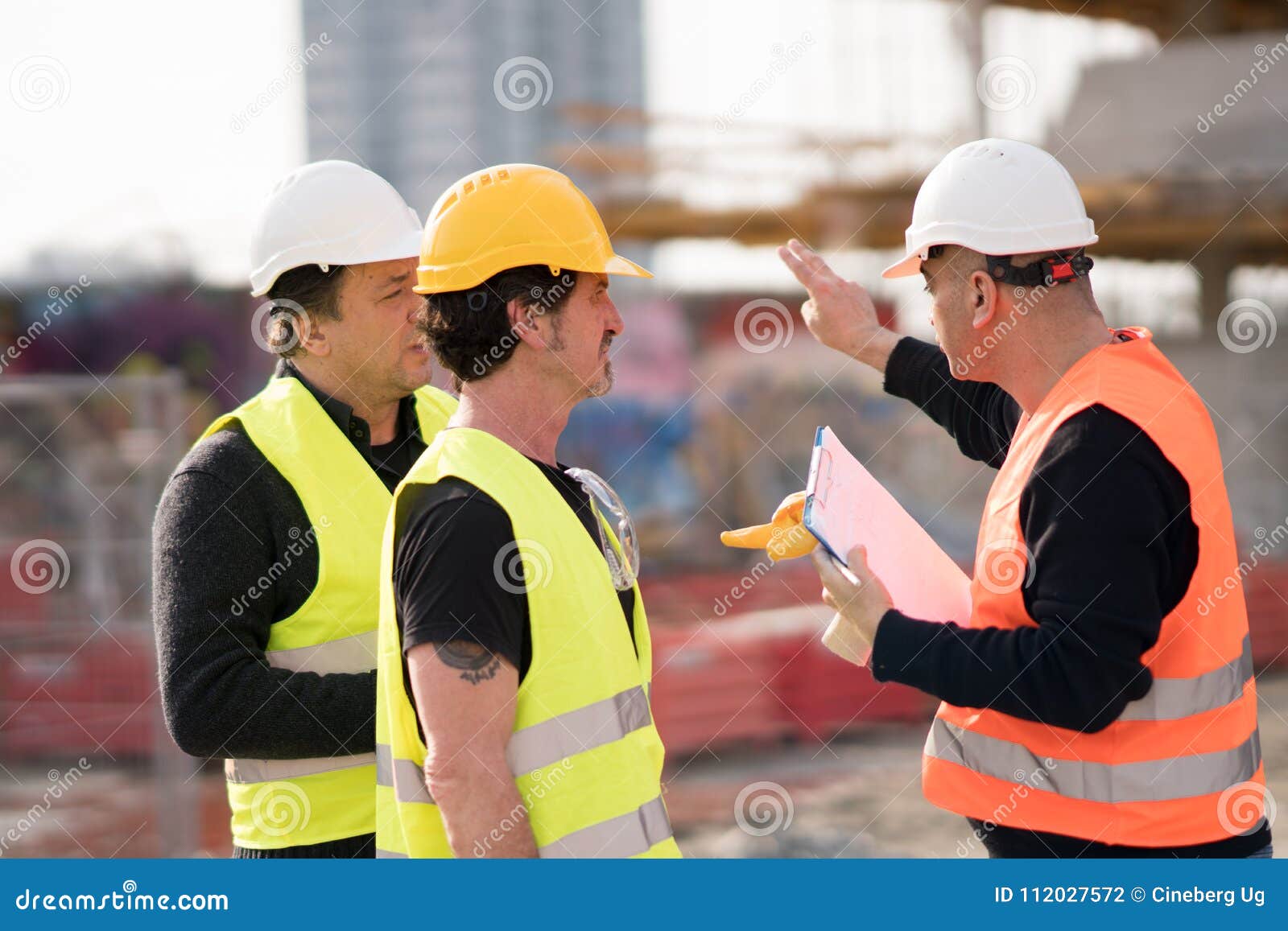 engineers and construction workers at work