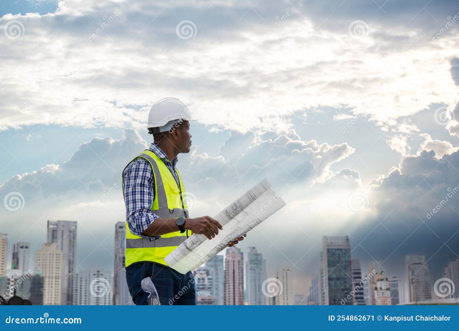 Engineers with Draft Plan of Building on Constructing Site. Engineer