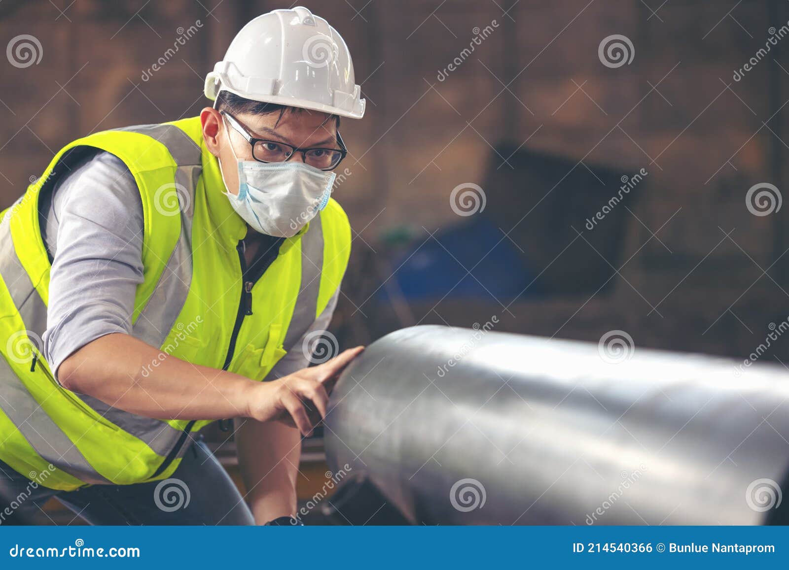 engineers examine new coated pipe in factory, ventory check