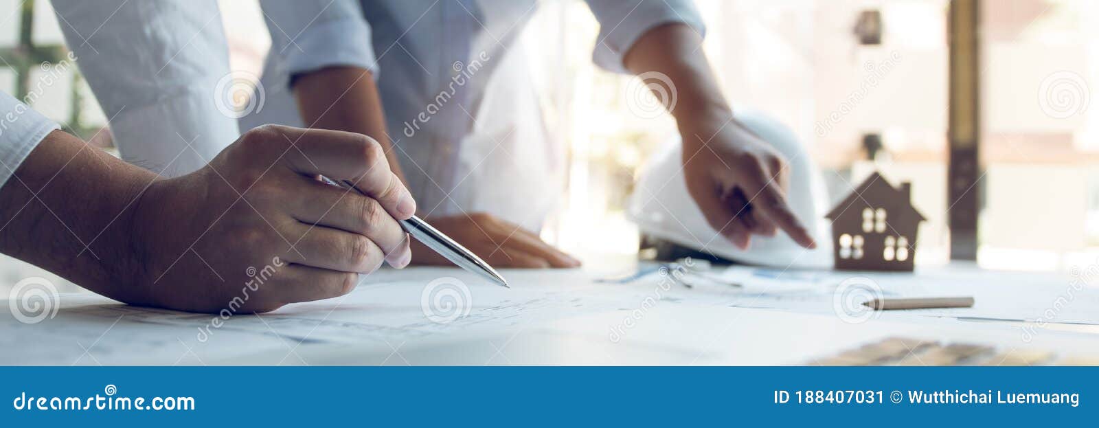 Engineers Are Helping To Design Work On Blueprints And Collaborate On