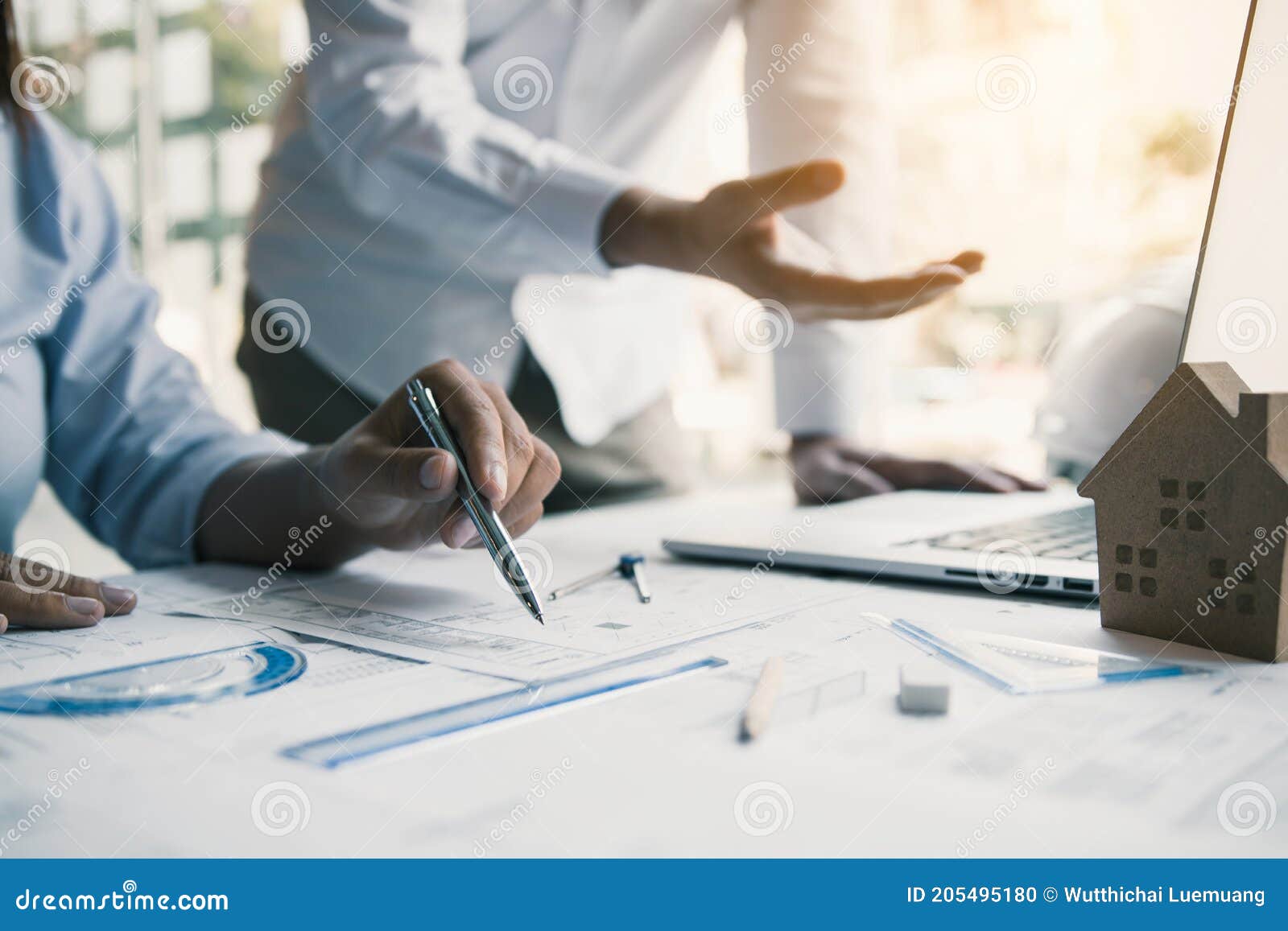 Engineers Are Helping To Design Work On Blueprints And Collaborate On