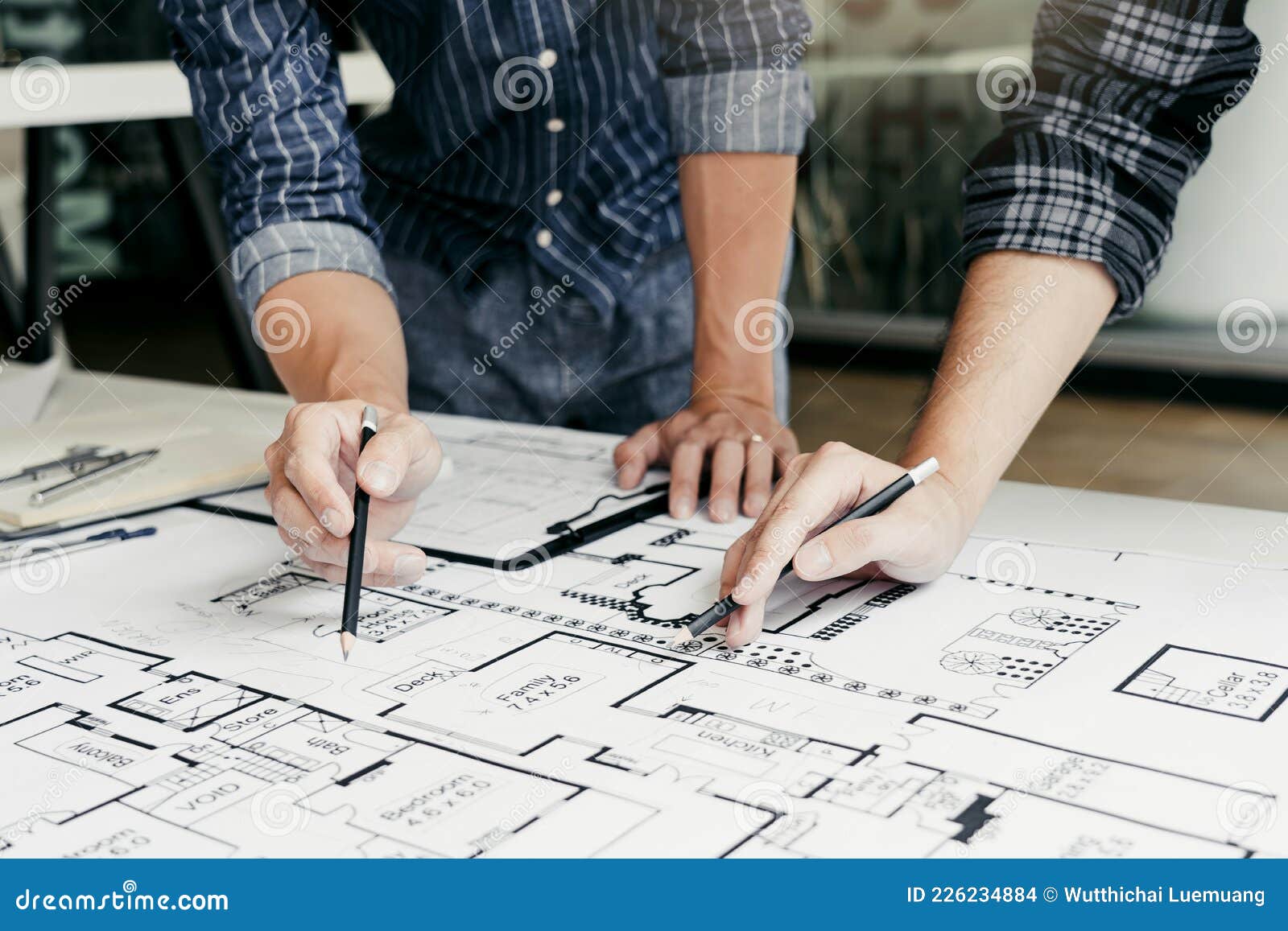 Engineers Are Helping To Design Work On Blueprints And Collaborate On