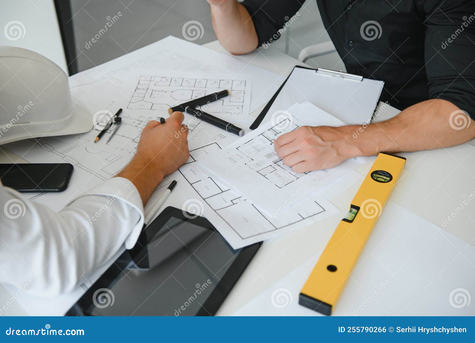 Engineers are Helping To Design Work on Blueprints and Collaborate on