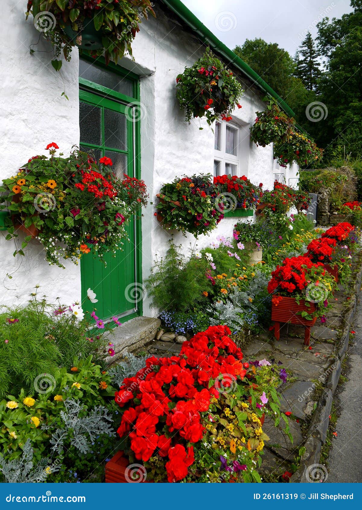 England White Cottage with Flower Planters Stock Image Image of
