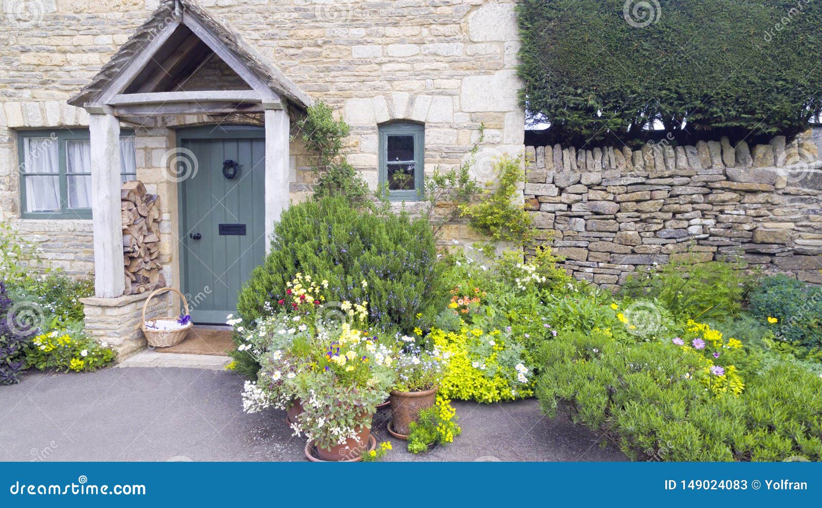 English Cottage Garden With Flowers, Herbs By A Stone House Porch . Stock  Image - Image Of English, Lush: 149024083