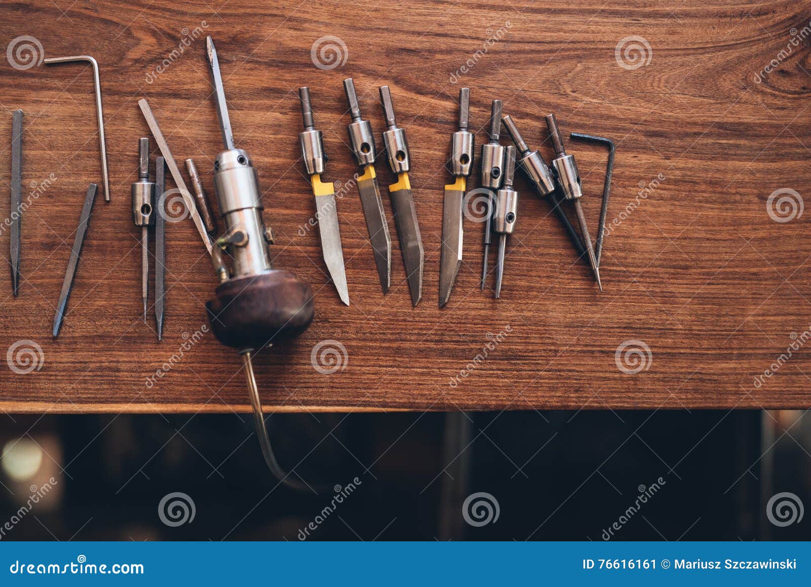 Hand engraving tools placing on table Stock Photo by ©mavoimages