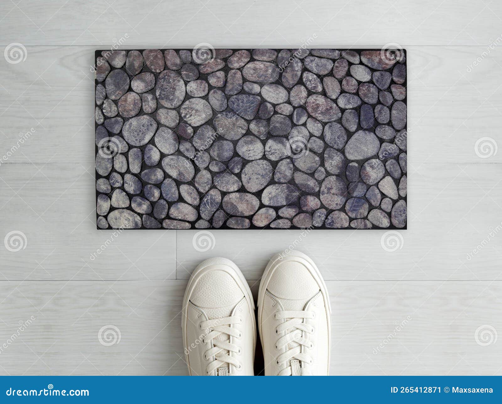 beautiful solid pebble stone pattern entry er doormat with white sneaker shoes