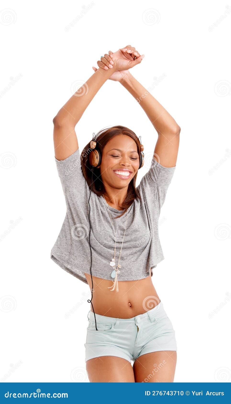 Enjoying the Beat. a Smiling Ethnic Woman Enjoying Her Headphones