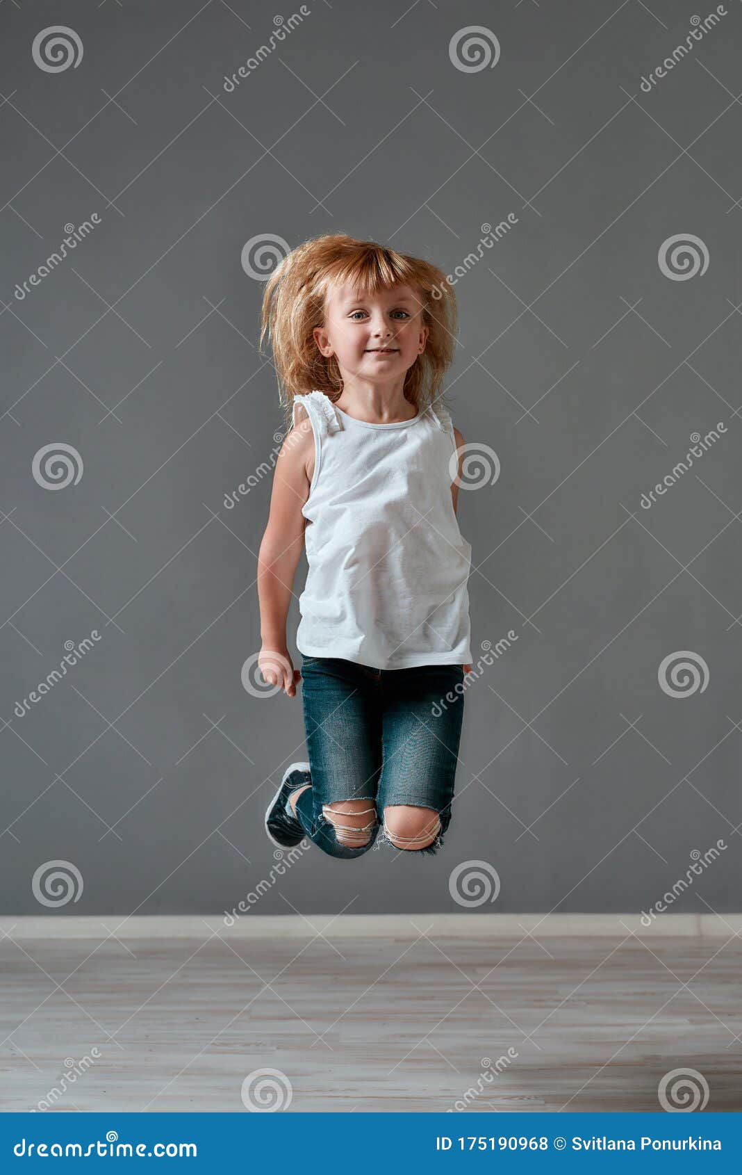 Enjoying Childhood. Portrait of a Cute and Excited Little Girl in Casual  Clothes Jumping in Studio and Looking at Camera Stock Photo - Image of  cheerful, background: 175190968