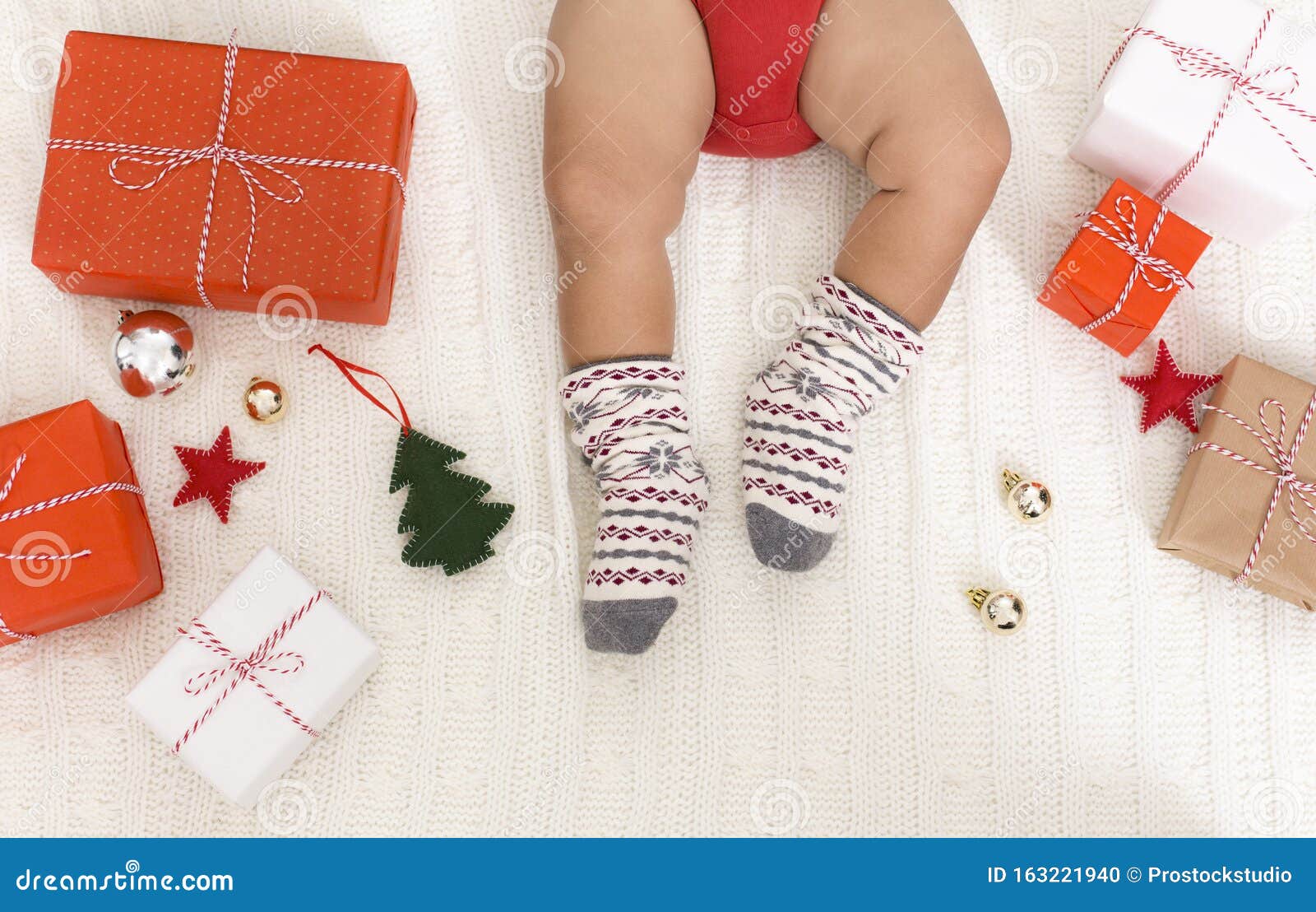 Cute Baby Legs in Warm Woolen Winter Socks with Xmas Gifts Stock Photo ...