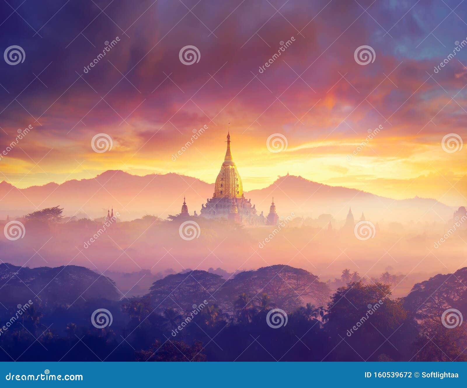 enjoying colorful sunset over of buddhist stupas and hot air balloon in the ancient bagan. myanmar, asia