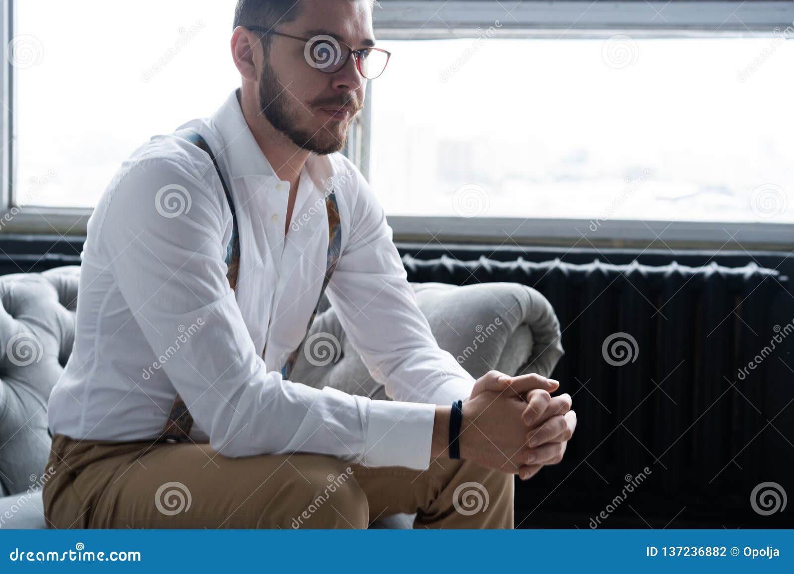 Enjoying Free Time. Thoughtful Young Man in Full Suit Looking Away ...