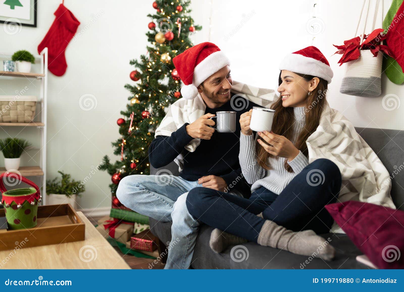 cute couple christmas tree, couple drinking hot chocolate under