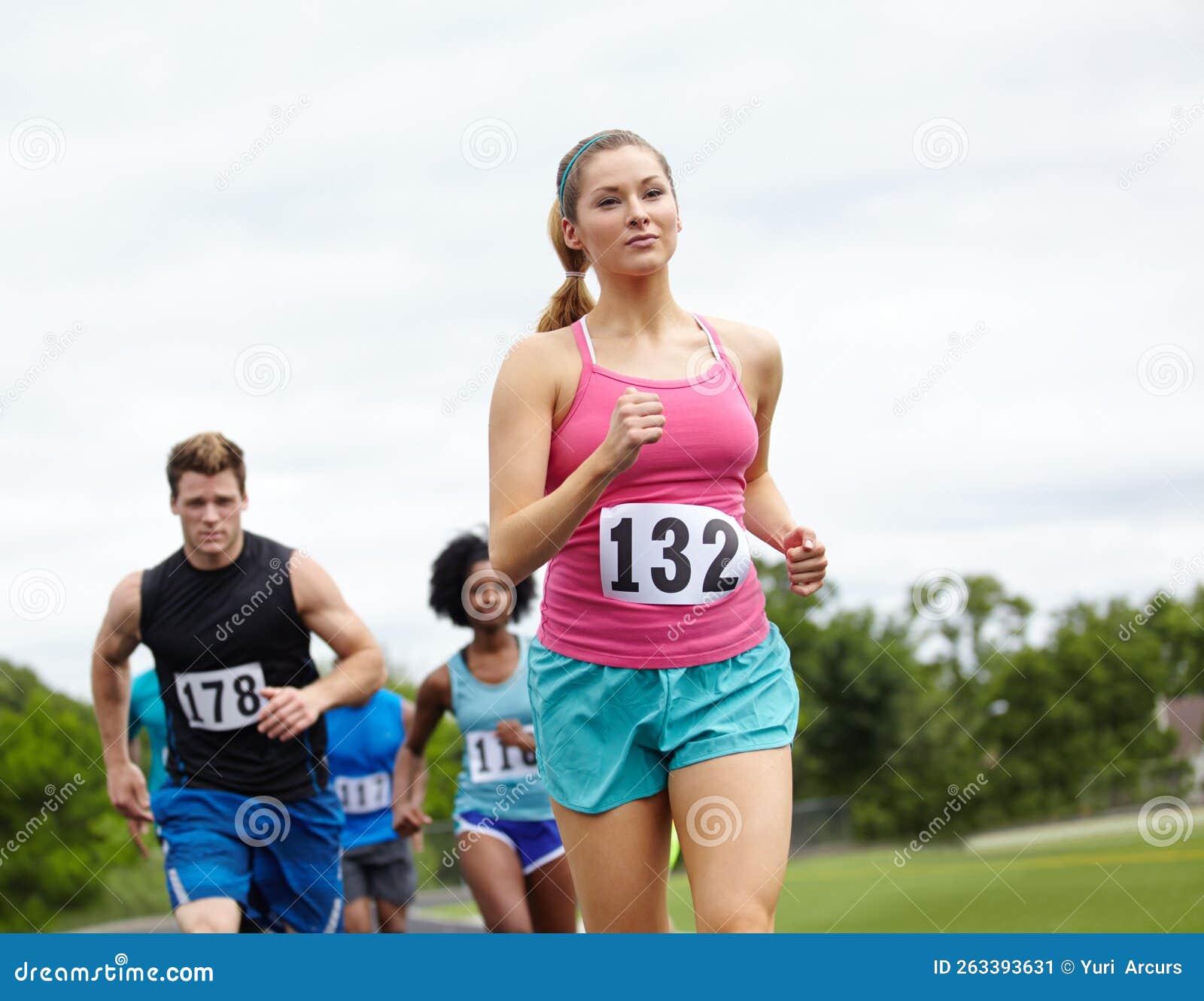 Enjoying the Marathon. Front View of a Determined Female Runner in