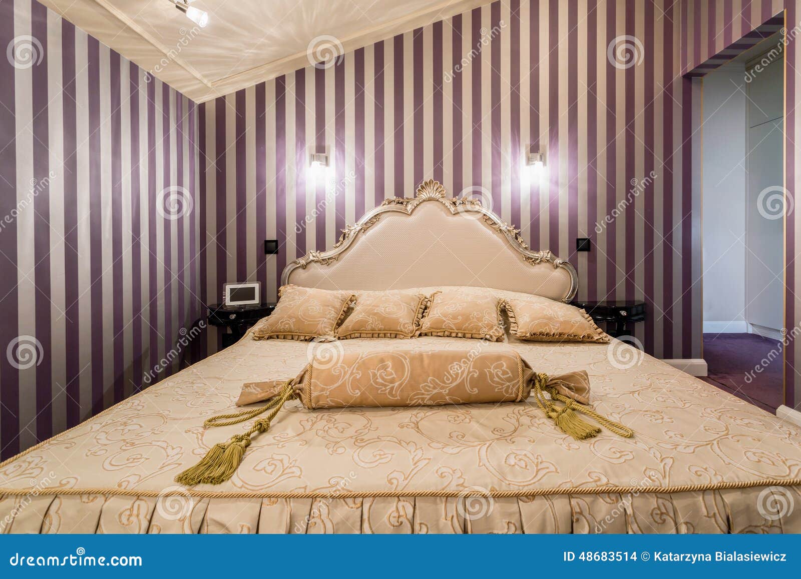 enormous bed inside baroque bedroom