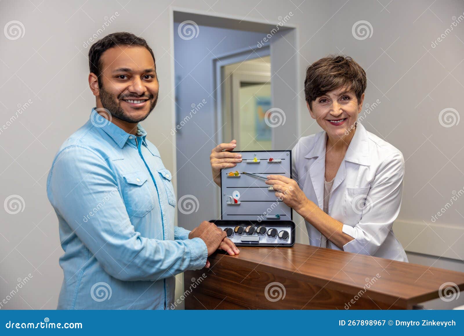 ENT Doctor Demostrating New Hearing Aid Tools Stock Image Image of