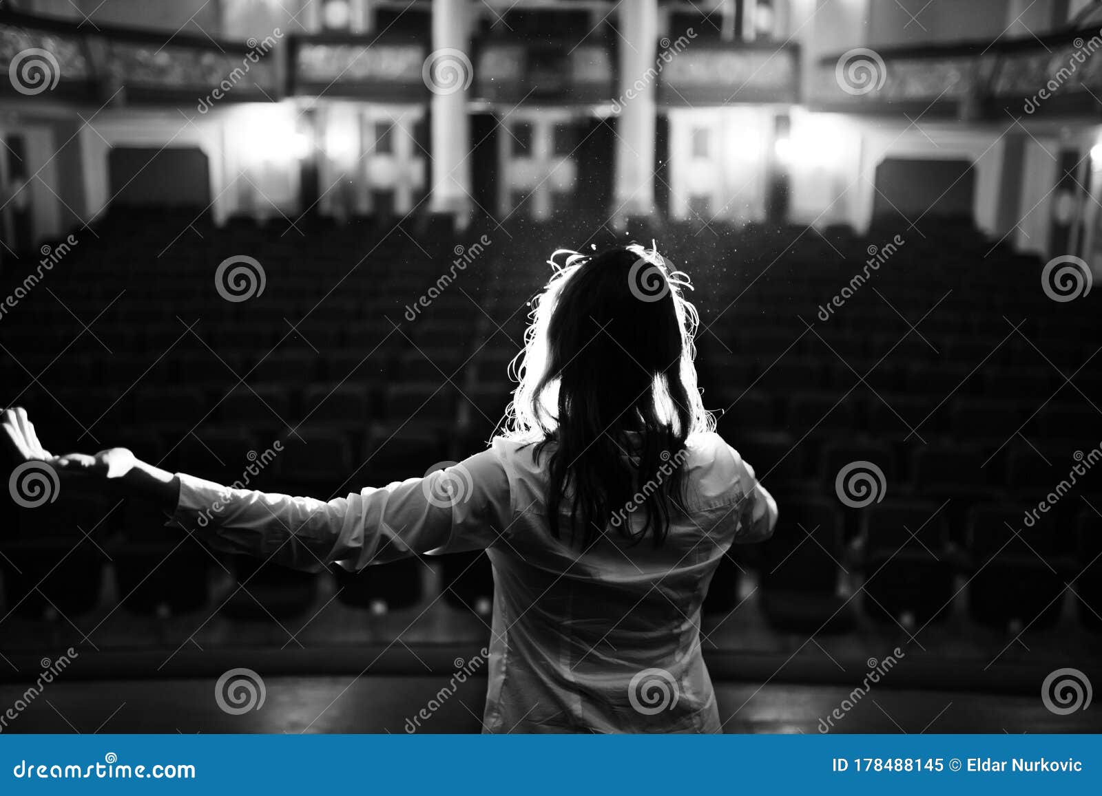 entertainer performing on a stage in a empty theater,concert hall without fans.no audience.covid-19 canceled show.opera house