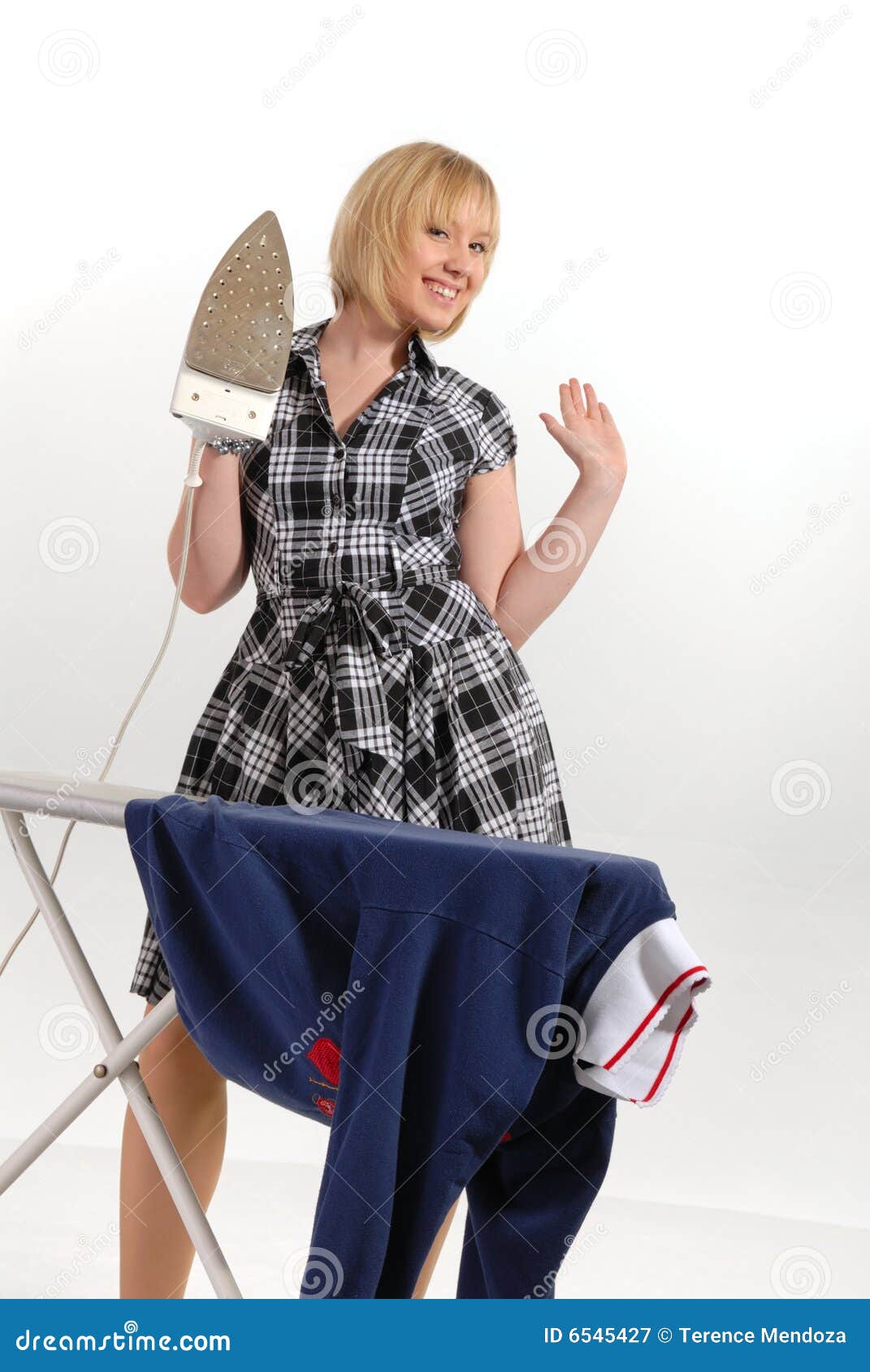 enthusiastic housewife ironing