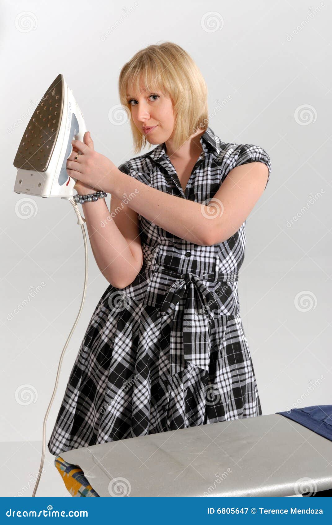 enthusiastic housewife ironing