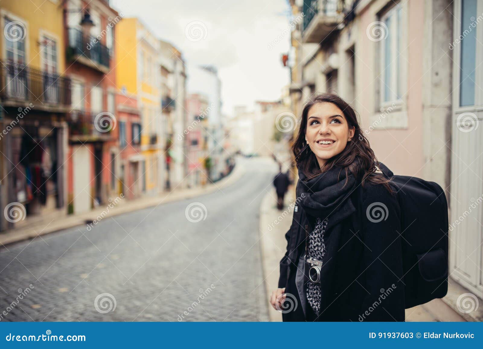 enthusiastic traveler woman walking streets of european capital.tourist in lisbon,portugal