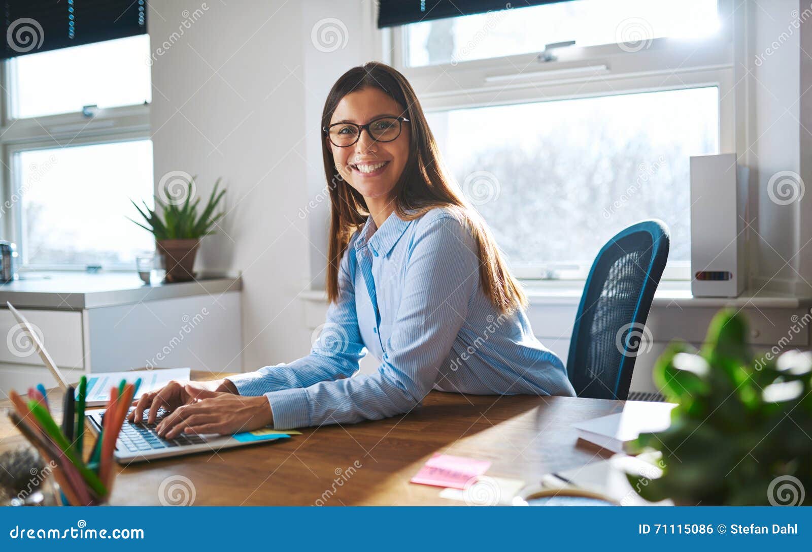 enthusiastic woman working at desk