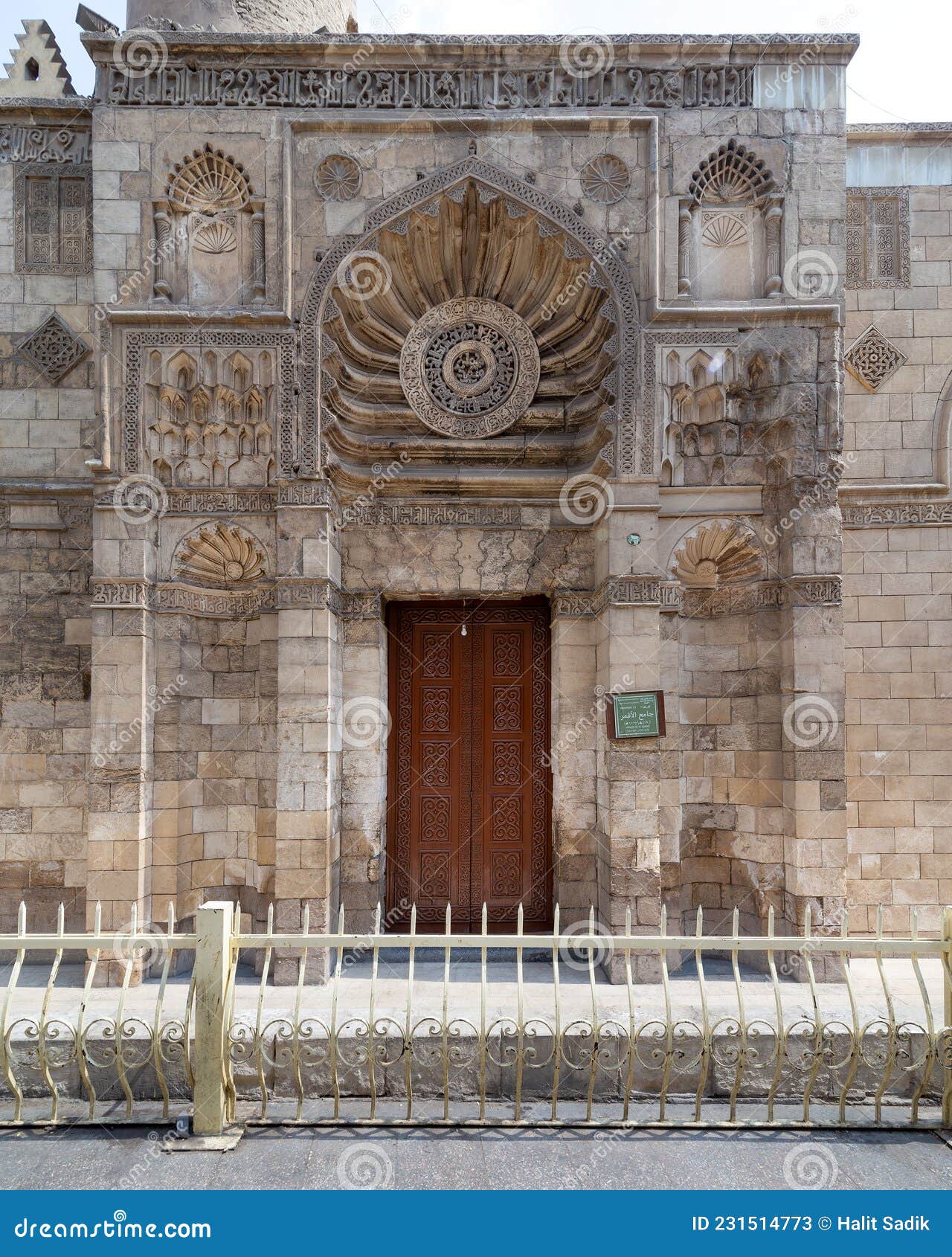 entrance of fatimid era aqmar mosque, with lavish decoration across the entire facade, muizz street, cairo, egypt