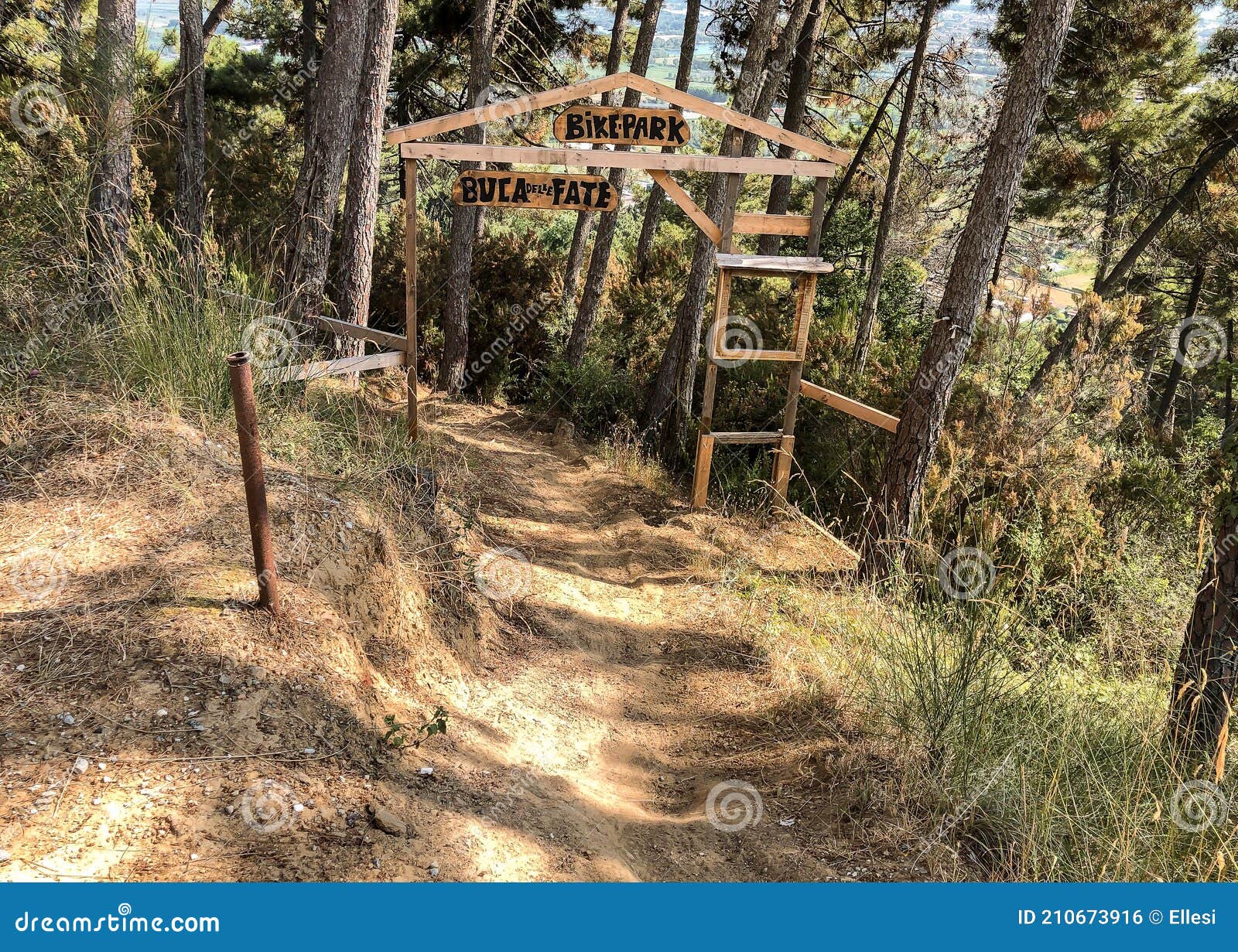 entrance to the buca delle fate archaeological naturalistic park in pian di mommio, italy