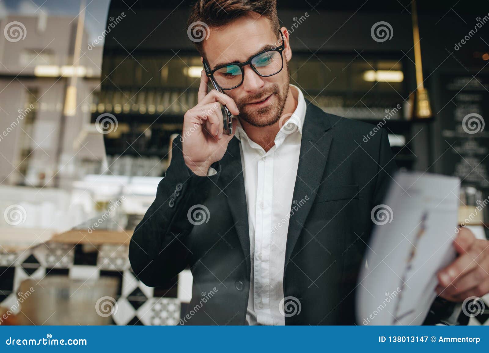  Entrepreneur  Talking On Cell Phone  Looking At Office 