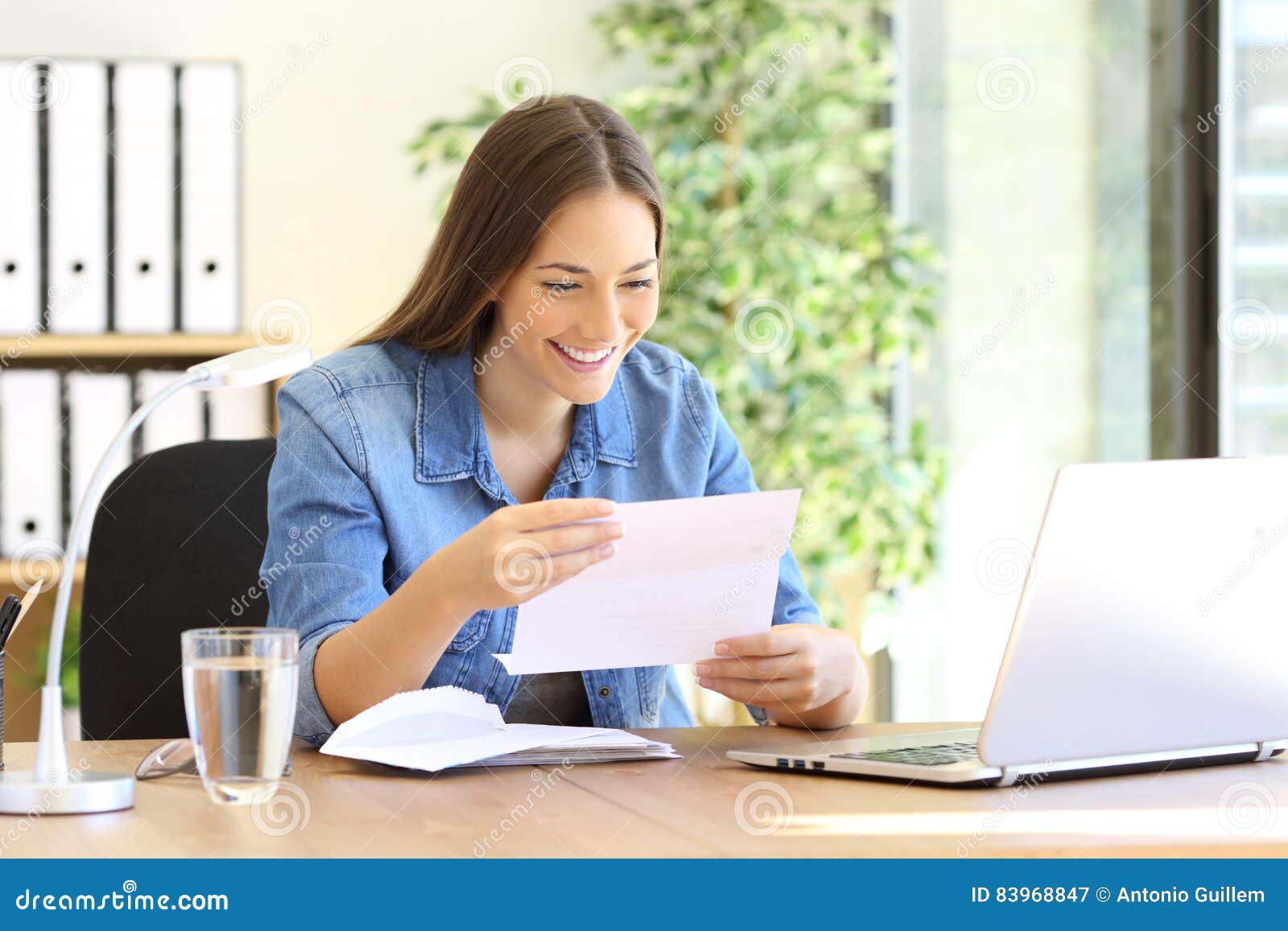 Entrepreneur Woman Reading A Letter At Office Stock Photo 