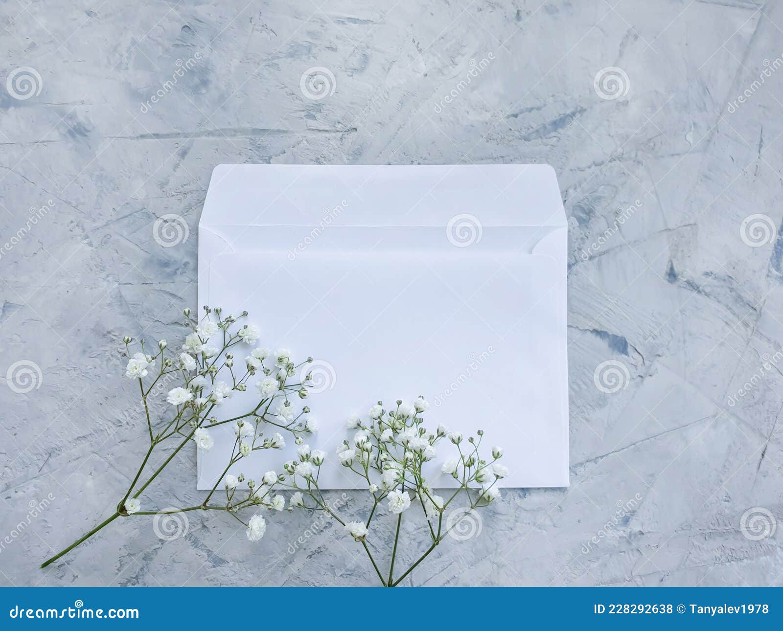 envelope flower beautiful  greeting  on concrete backgroundn floral invitation