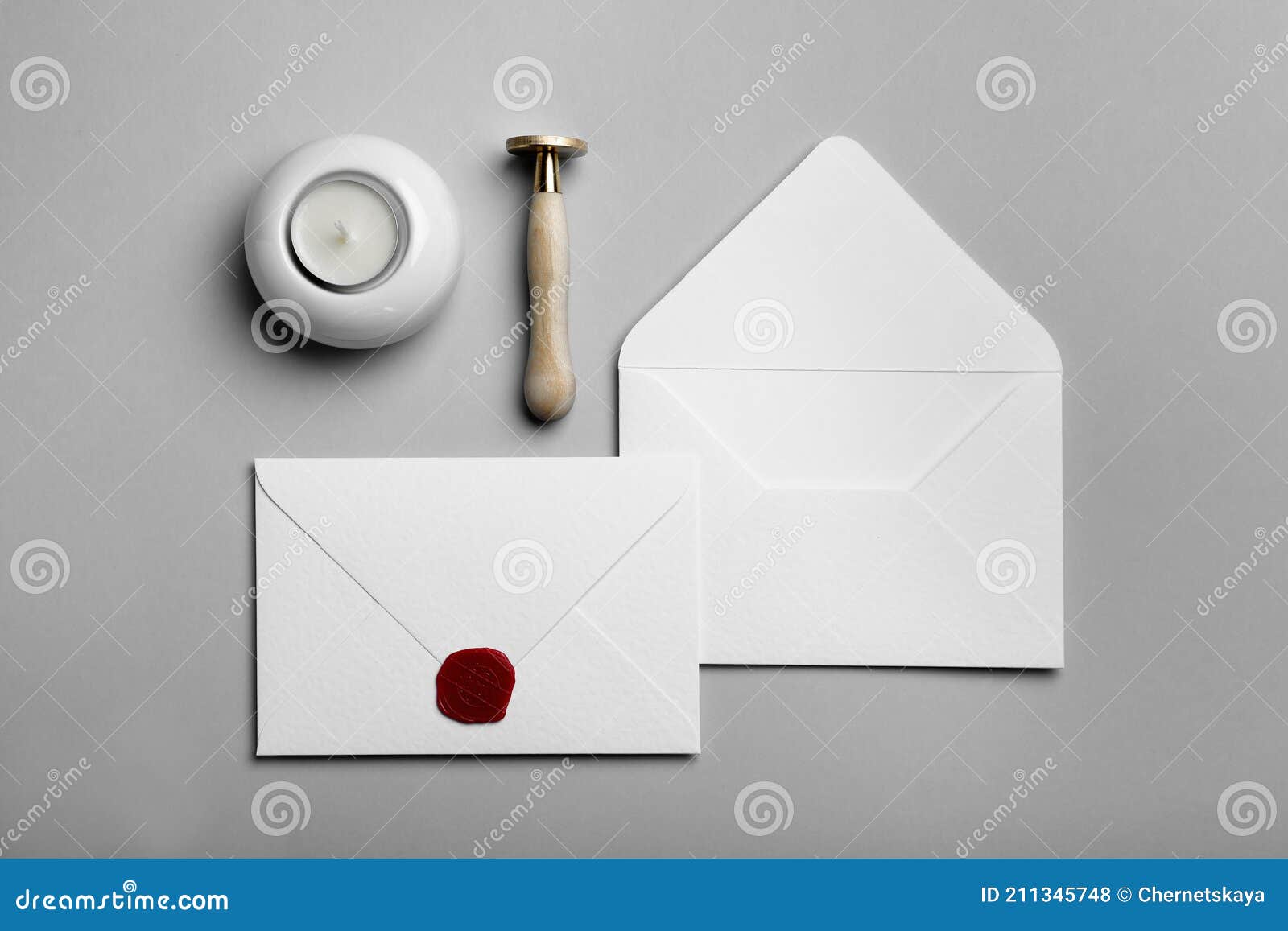 Envelopes with Wax Seal, Candle and Stamp on Grey Background, Flat Lay