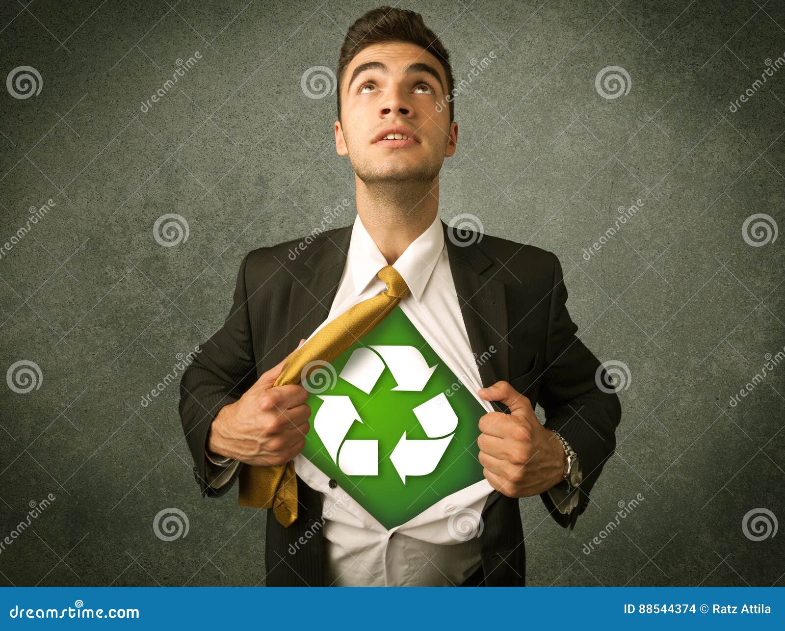 enviromentalist business man tearing off shirt with recycle sign