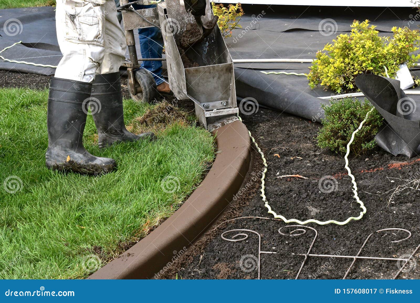 Concrete Curb Edging Being Formed Around A Flower Bed ... Concrete Curb Edging Being Formed Around A Flower Bed ...