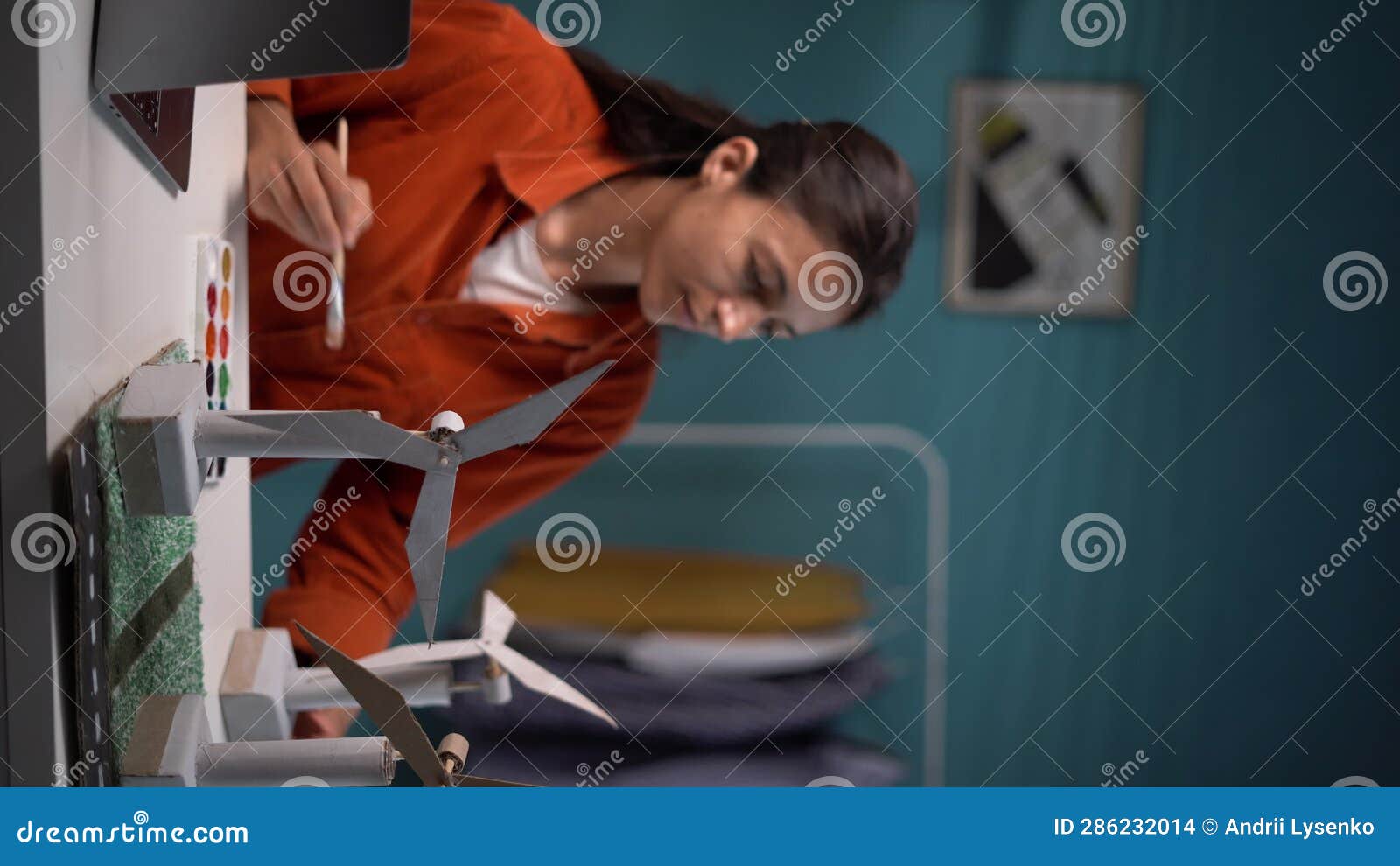 Environmentalist Sitting in Her Home Office and Drawing New Windmill