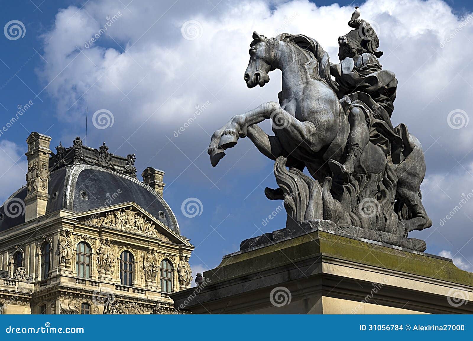 equestrian statue of king louis xiv in courtyard of the louvre museum