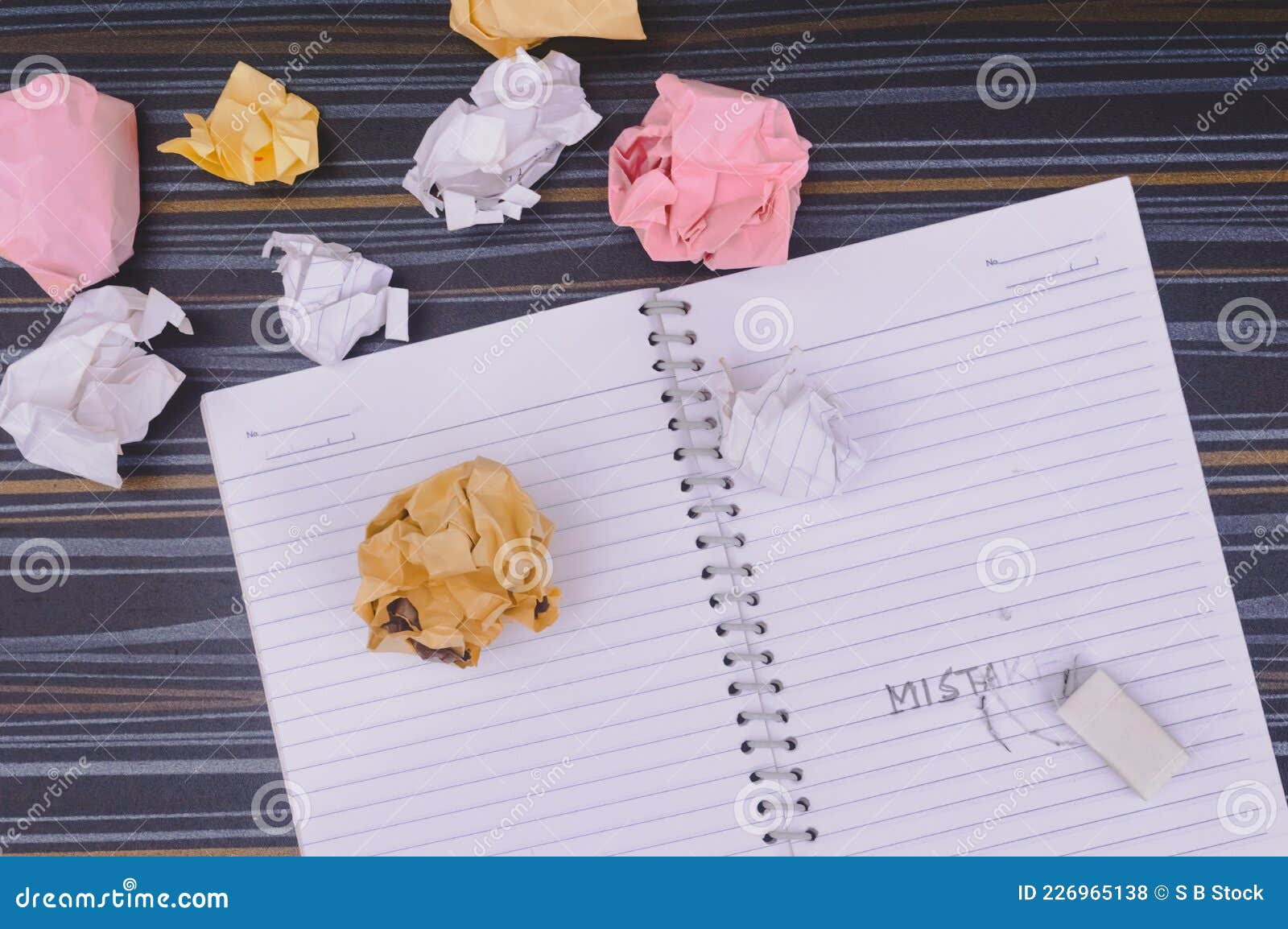 erasing mistake on notepad. learning, wrong, blooper, regret sayings background. fault, defect, careless, lesson correction and