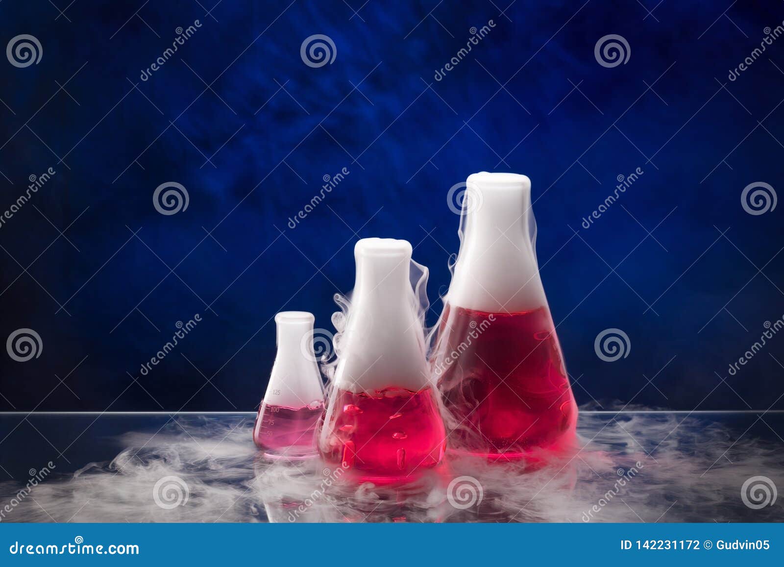 erlenmeyer flask with red liquid on the table