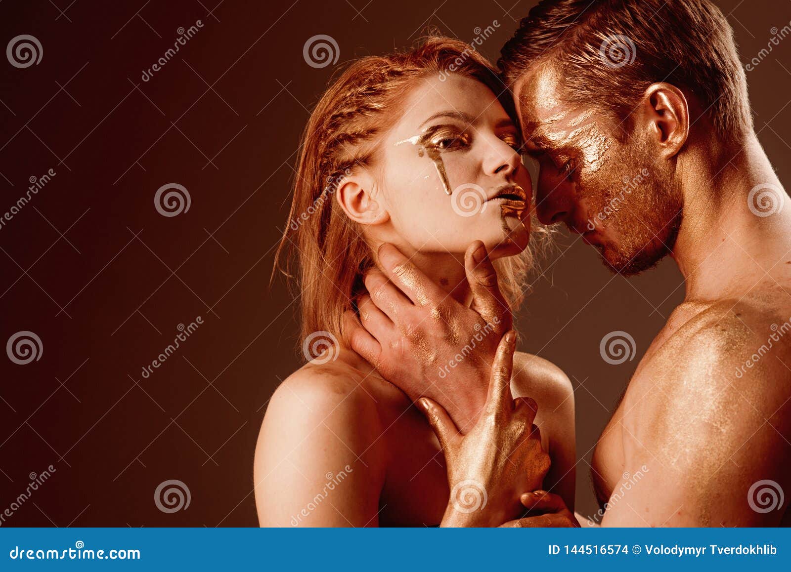 erotica concept. erotica with couple having golden body and touching each other, copy space.