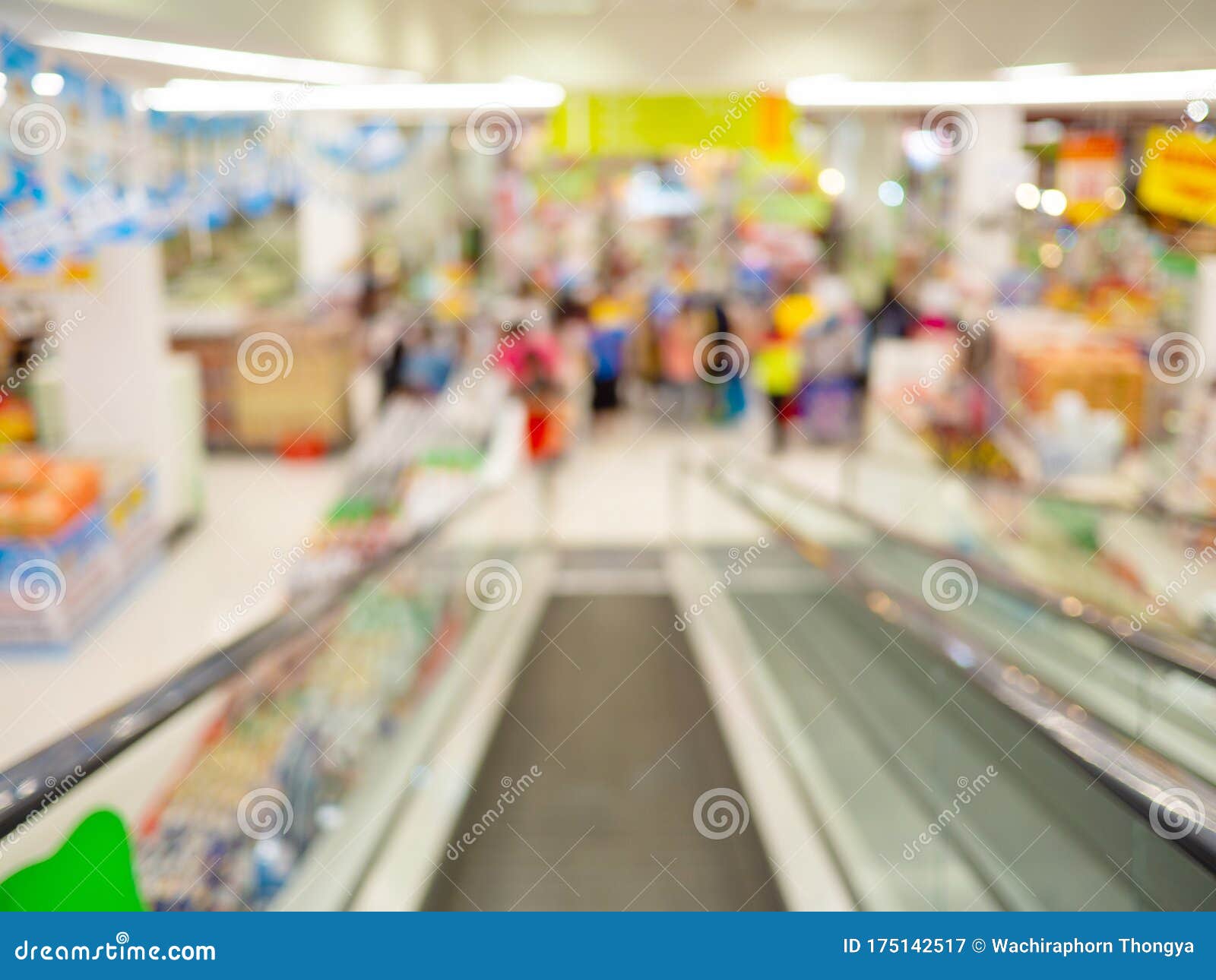 escalator inside supermarket, blurred shopping mall and retails store interior for background, shopping concept.