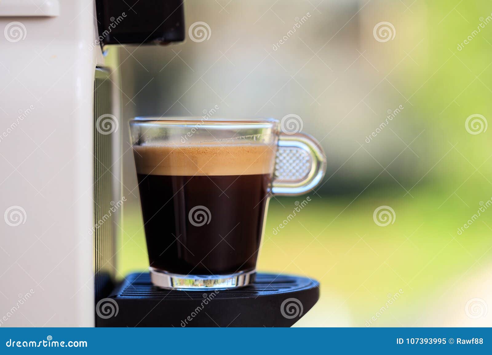 Espresso Coffee Machine On A Blur Green Background Space For Text