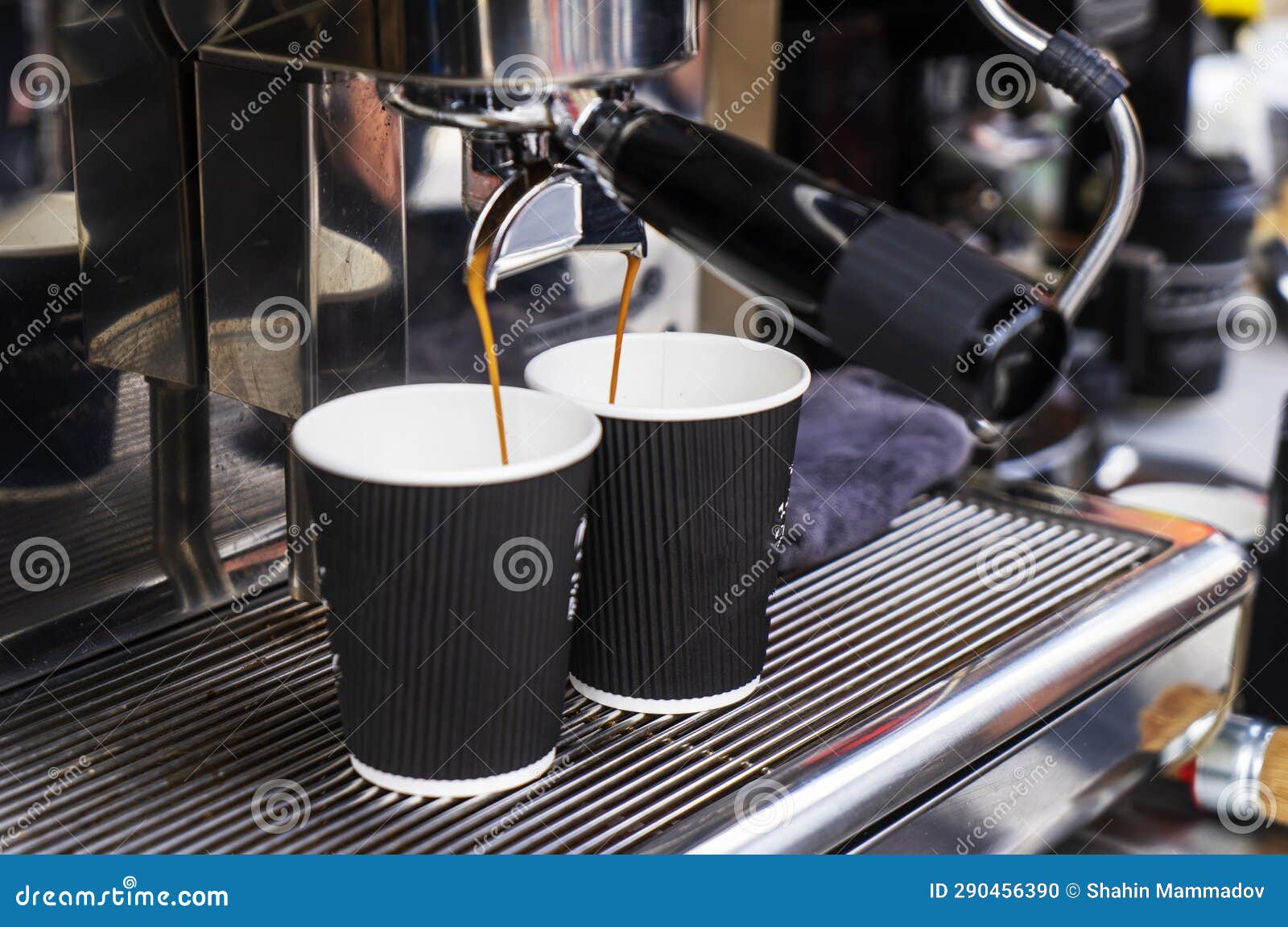 Espresso Coffee Machine Pouring Coffee into Two Paper Cups Stock Photo